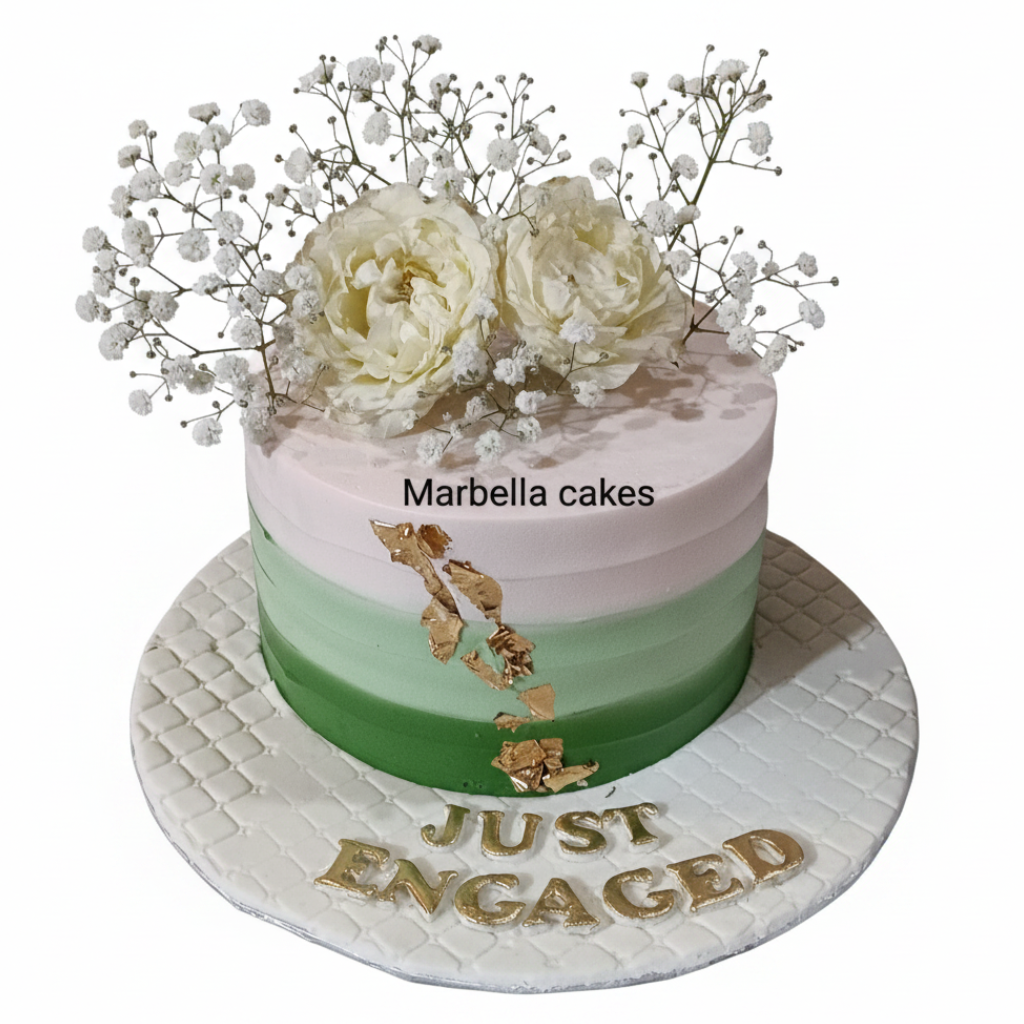 Green ombre engagement cake with gold leaf, cream peonies, baby's breath, and Just Engaged gold lettering on white background