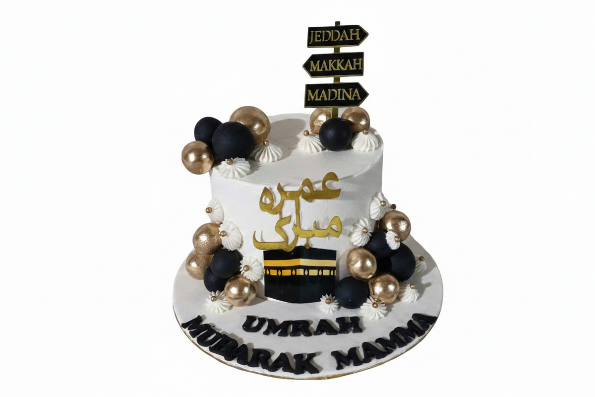 Umrah Mubarak Arabic calligraphy cake with white background