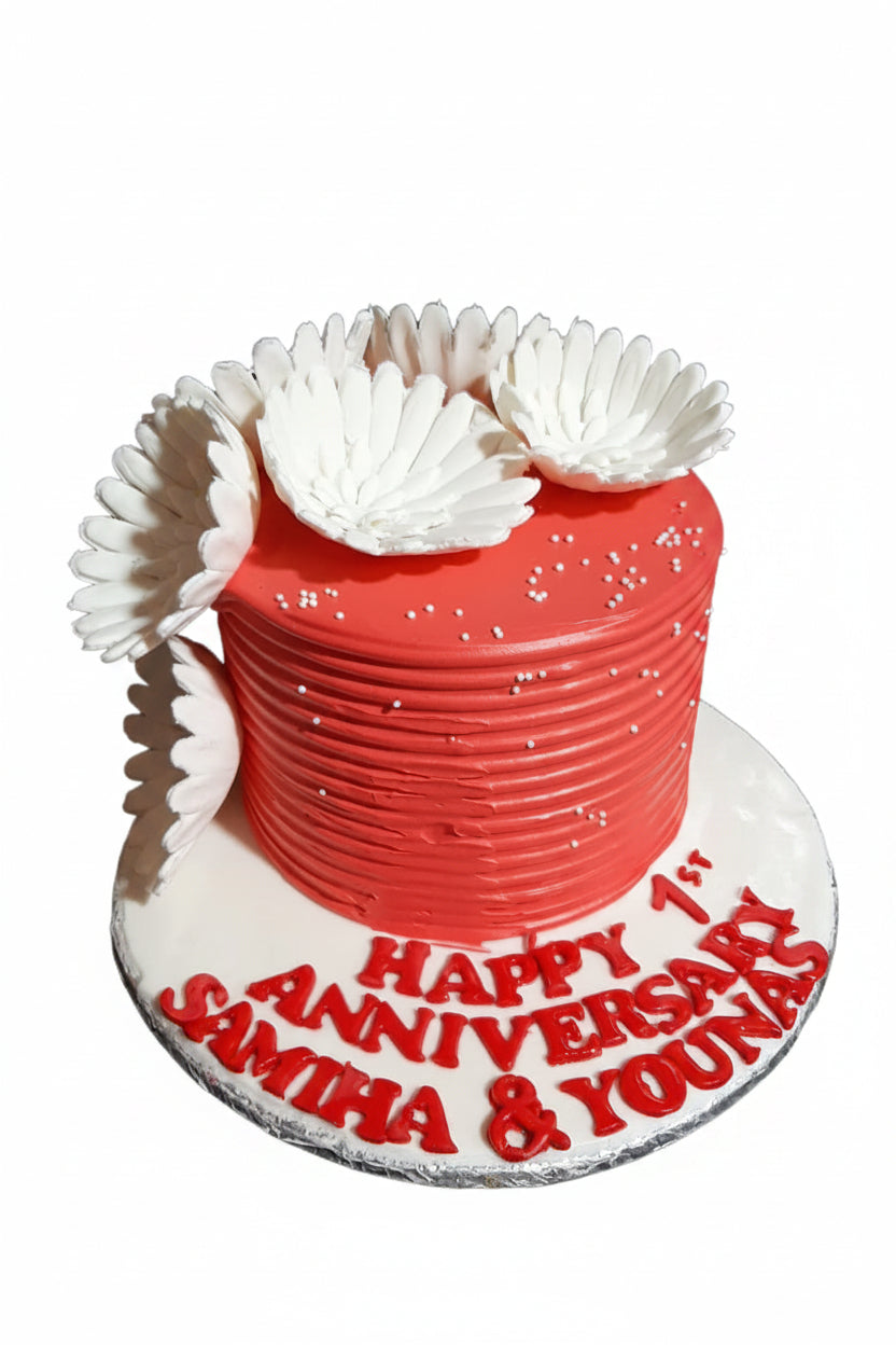 Happy 1st Anniversary red textured buttercream cake with white daisy florals and custom name board by Marbella Cakes