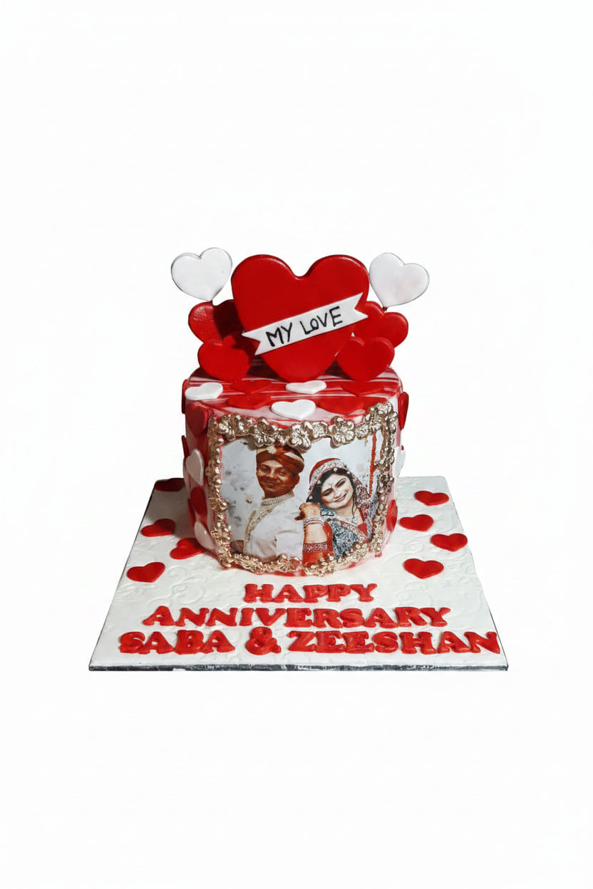 Happy Anniversary My Love red heart cake with gold photo frame, couple photo and red fondant name board by Marbella Cakes