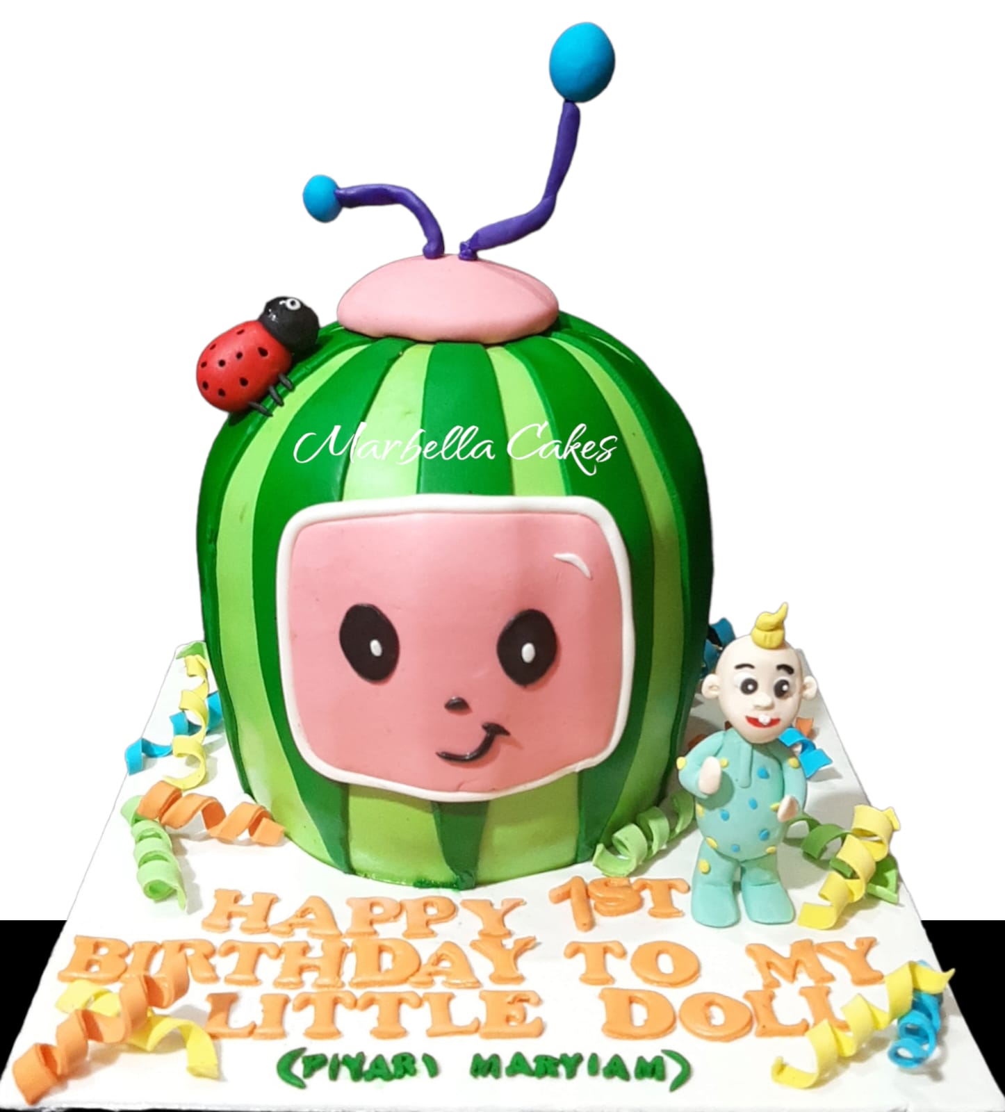 CoComelon 3D sculpted watermelon head cake with JJ baby figurine, fondant antenna, ladybug, and personalized birthday message board