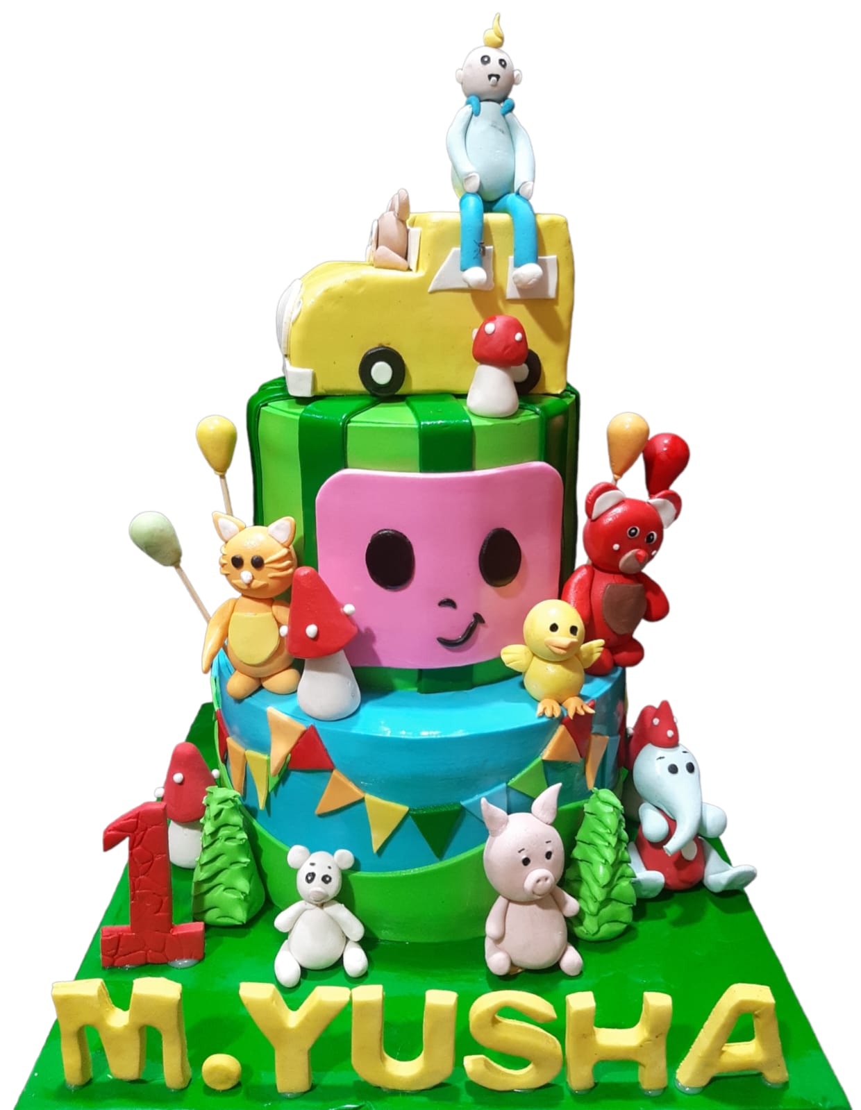 CoComelon 3-tier birthday cake with school bus top tier, CoComelon face middle tier, green base tier with bunting, and full cast of fondant animal character figurines