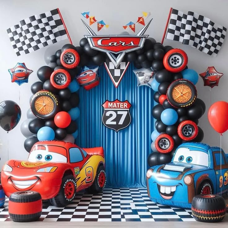 Disney Cars birthday decoration with Lightning McQueen Mater inflatables, black red blue balloon arch, checkered flags and Cars logo backdrop