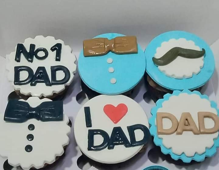 Box of 6 Father's Day cupcakes in blue and white fondant with No1 Dad lettering, bow tie suit design, moustache topper and I Love Dad message