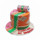 Dholki themed custom celebration cake on white background