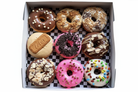Ultimate assorted donut box with 9 gourmet flavors on white background