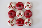 Valentine's red and white heart donuts on white background