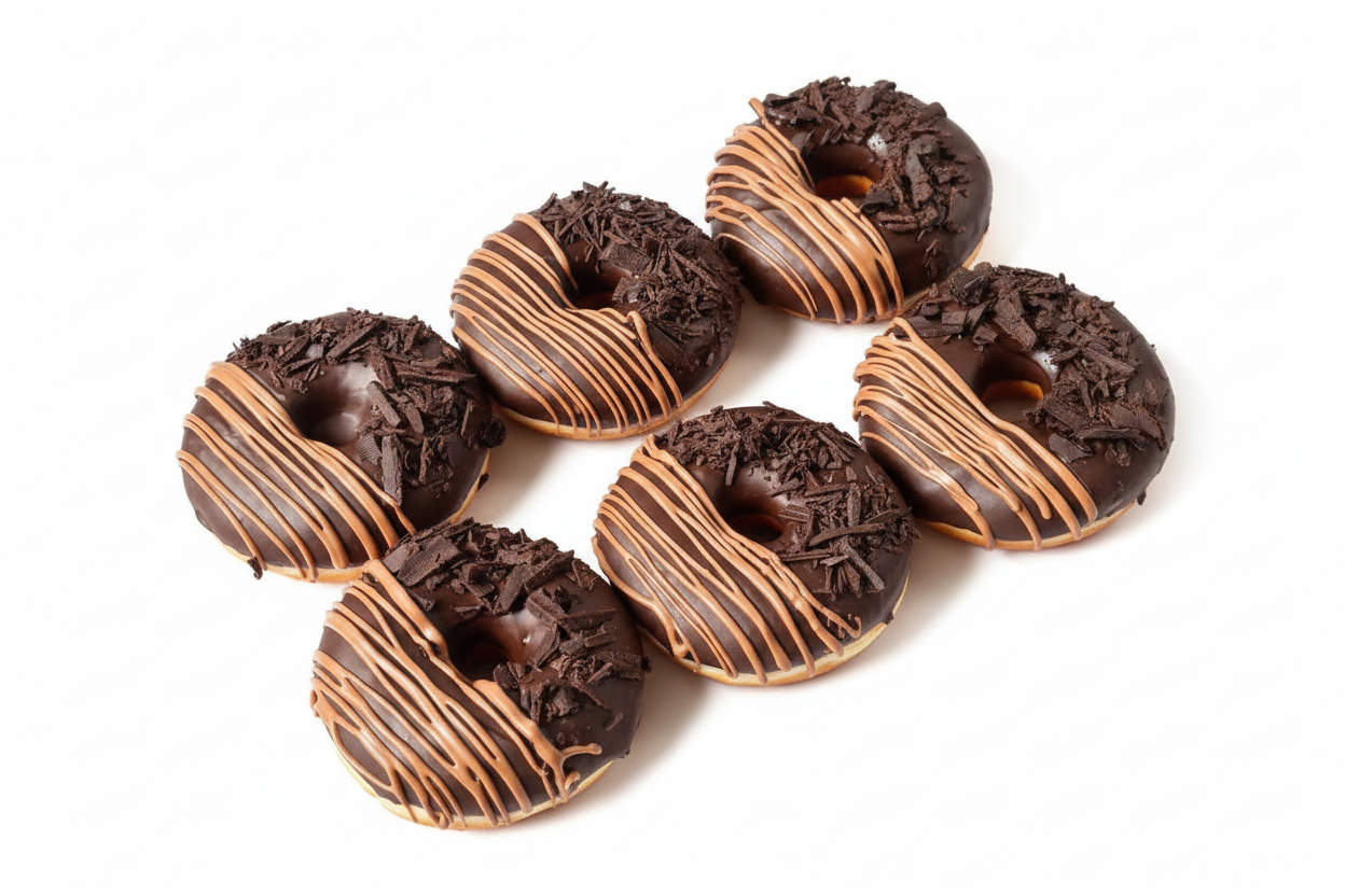 Dark chocolate shaving donuts with milk chocolate drizzle on white background