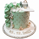 Mint green quilted engagement cake with ring box topper, ruffle flowers, gold pearl accents and silver date lettering on white background