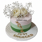 Green ombre engagement cake with gold leaf, cream peonies, baby's breath, and Just Engaged gold lettering on white background